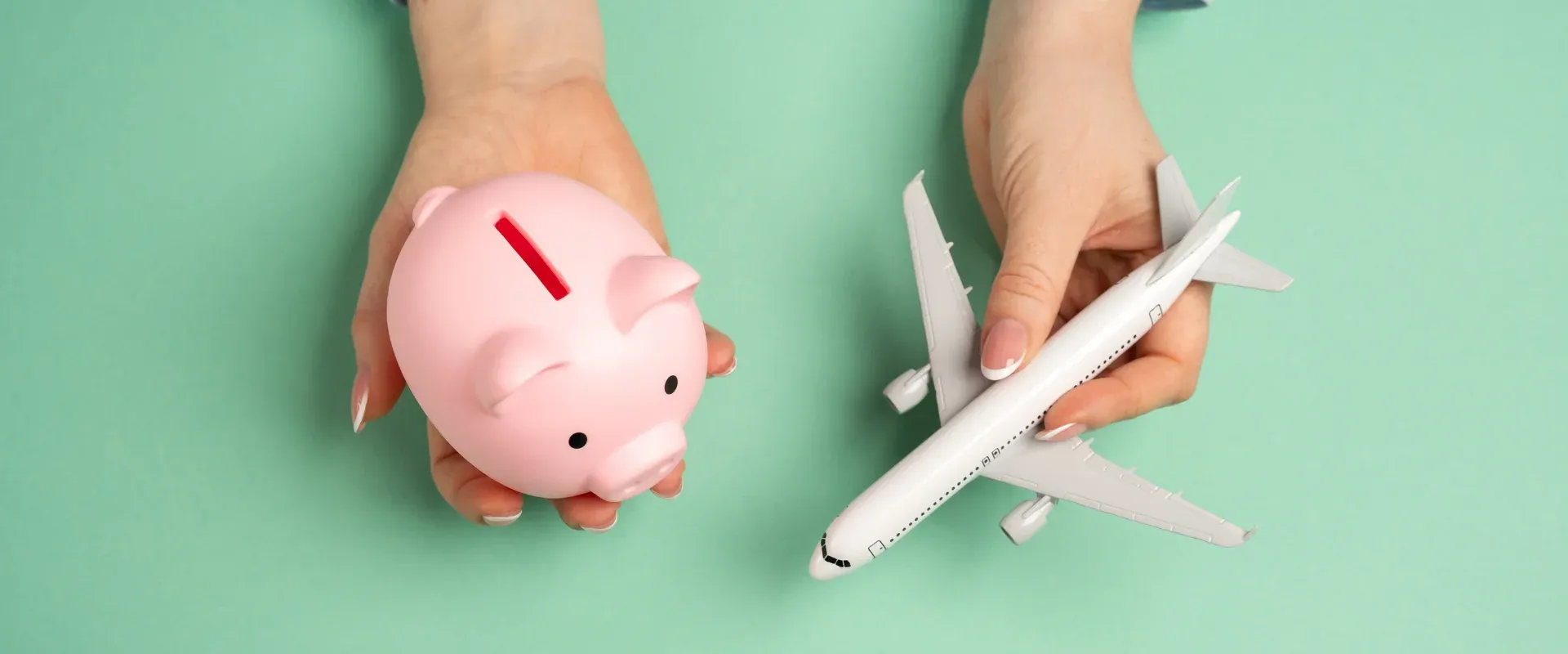 Piggy bank and passenger plane. Save on flights. Accumulate bonuses under the loyalty program. Maximizing discounts on airline tickets. Financial planning for vacations and smart spending.